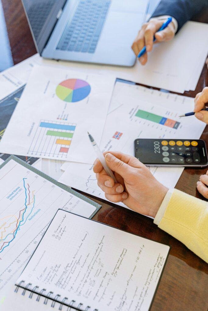 pexels-photo-5816298-5816298 A close-up of businesspeople analyzing financial data and charts during a meeting.